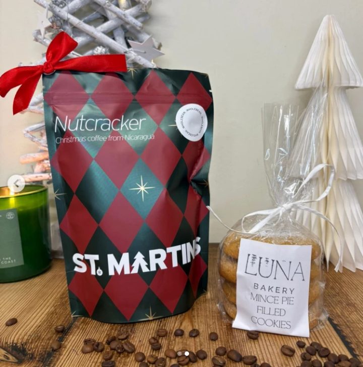 A Christmas gift set: St Martin's Nutcracker coffee beans beside a bag of our mince-pie-filled cookies